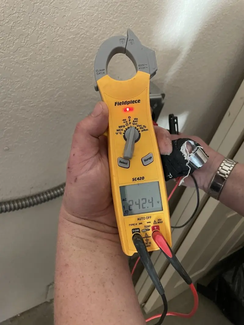 Voltage testing with clamp meter during Outlet Installation in Highland